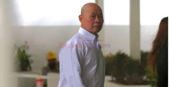 Singapore: Yue Kim Ming (62) charged in court for beating a red light and voluntarily causing hurt to an elderly man