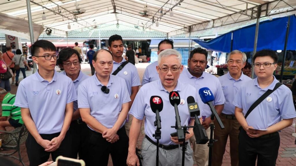 Urgent press conference at Sure Boh marketplace, local leaders discuss community issues and safety.