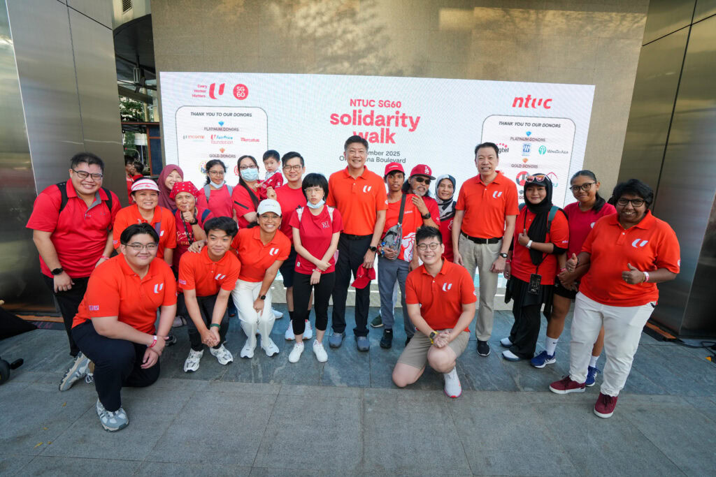 NTUC Secretary General Ng Chee Meng, NTUC Assistant Secretary General Melvin Yong and President K. Thanaletchimi with NTUC Care Beneficiaries