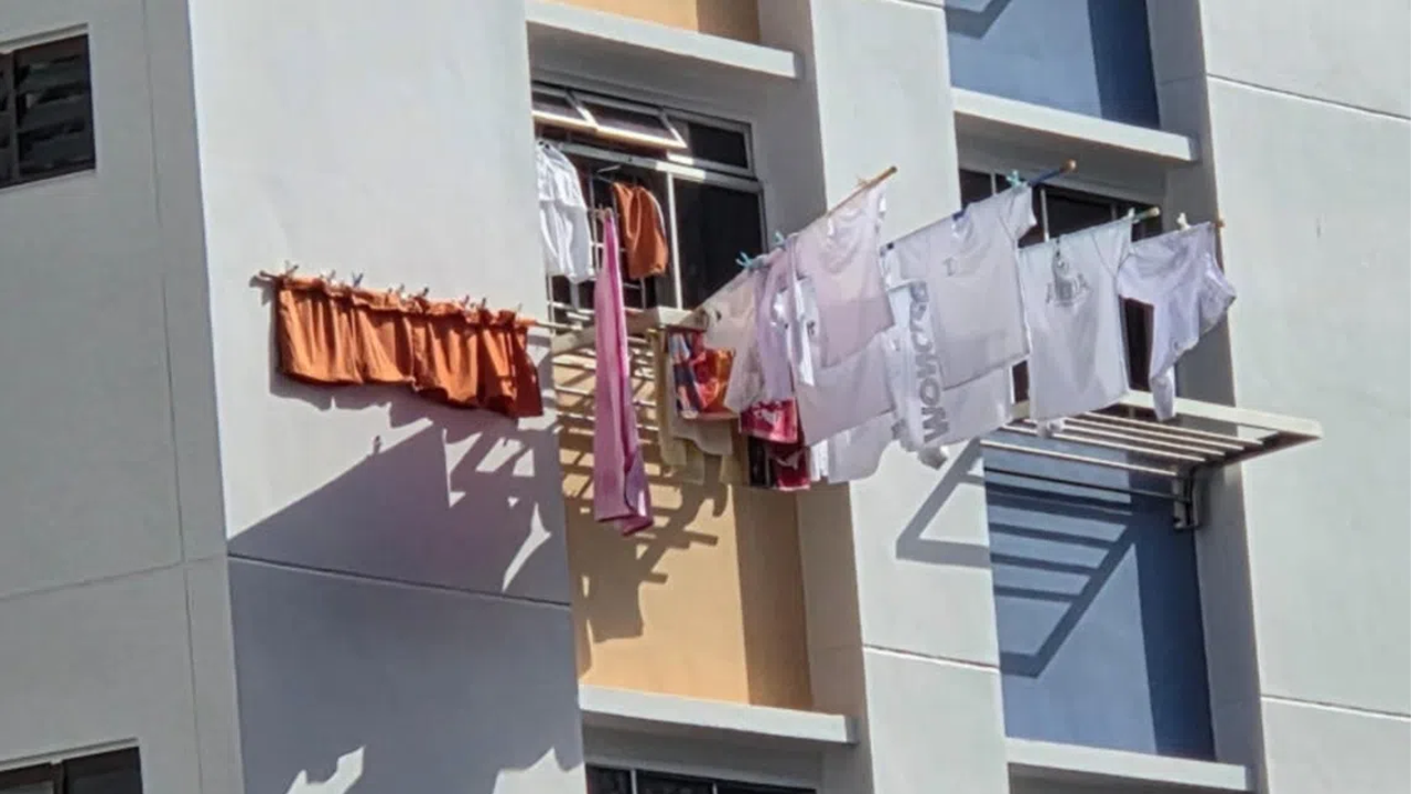 Yishun resident worried over bamboo poles on new HDB laundry rack, auntie insists everything is tied securely