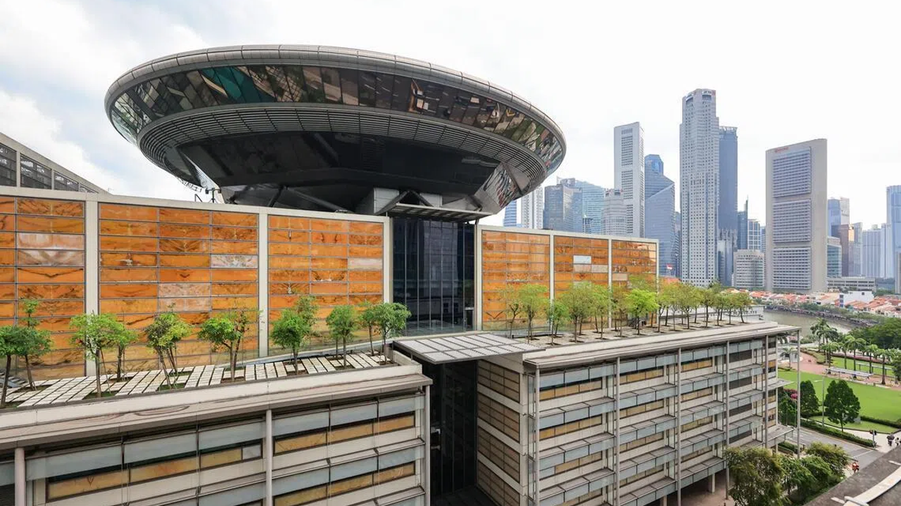 Modern city skyscrapers with futuristic architecture and green rooftop gardens in downtown.