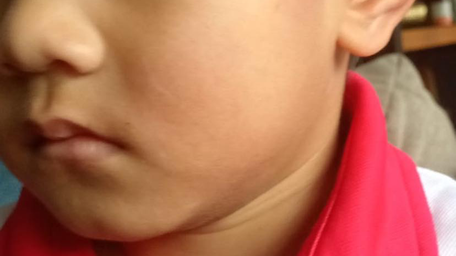 Child showing middle finger, raising questions about parenting and discipline.